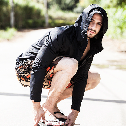NAROO UV Breaker black hooded jacket worn by a man outdoors
