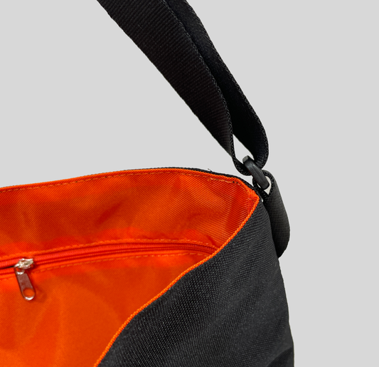 NAROO Musette Bag black musette bag open, showing the orange lining