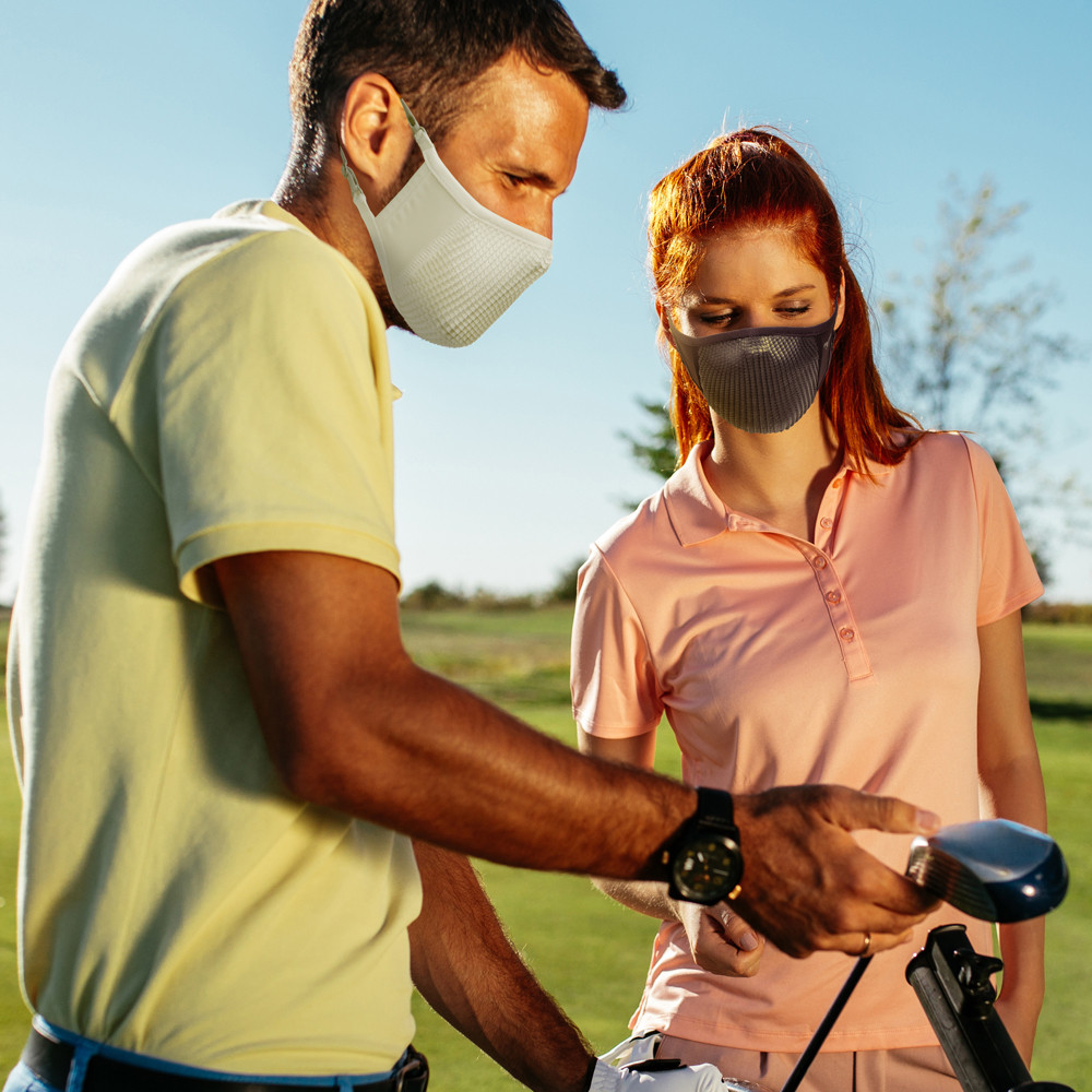NAROO N0U face covers worn by two people beside a bicycle