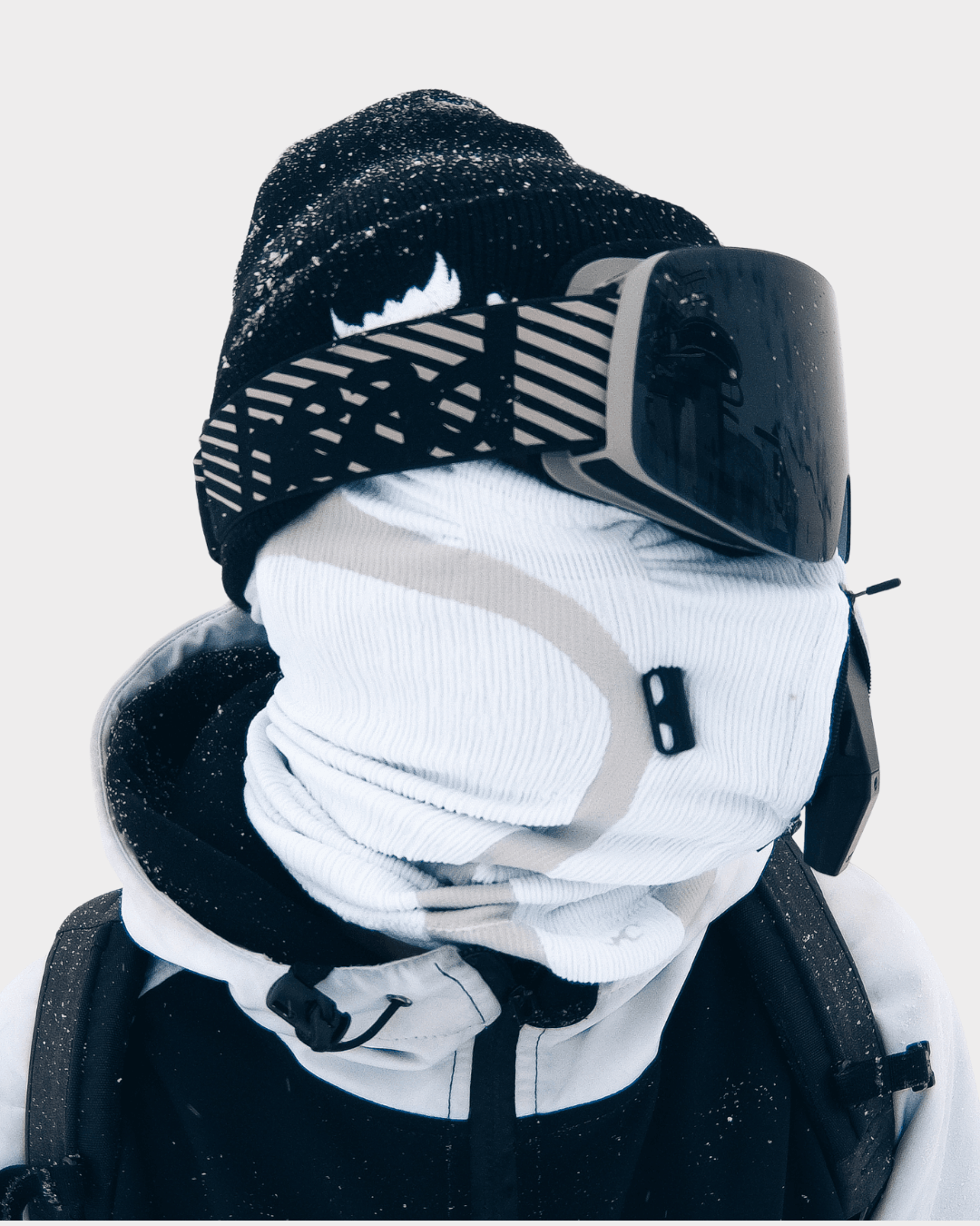 NAROO EX|HALE accessory worn with a face cover and goggles in the snow