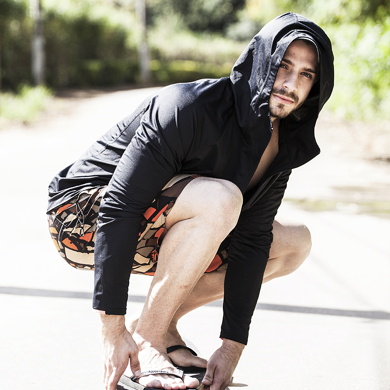 NAROO UV Breaker black hooded jacket worn by a man outdoors