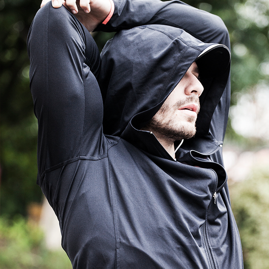 NAROO UV Breaker black hooded jacket worn with arms raised