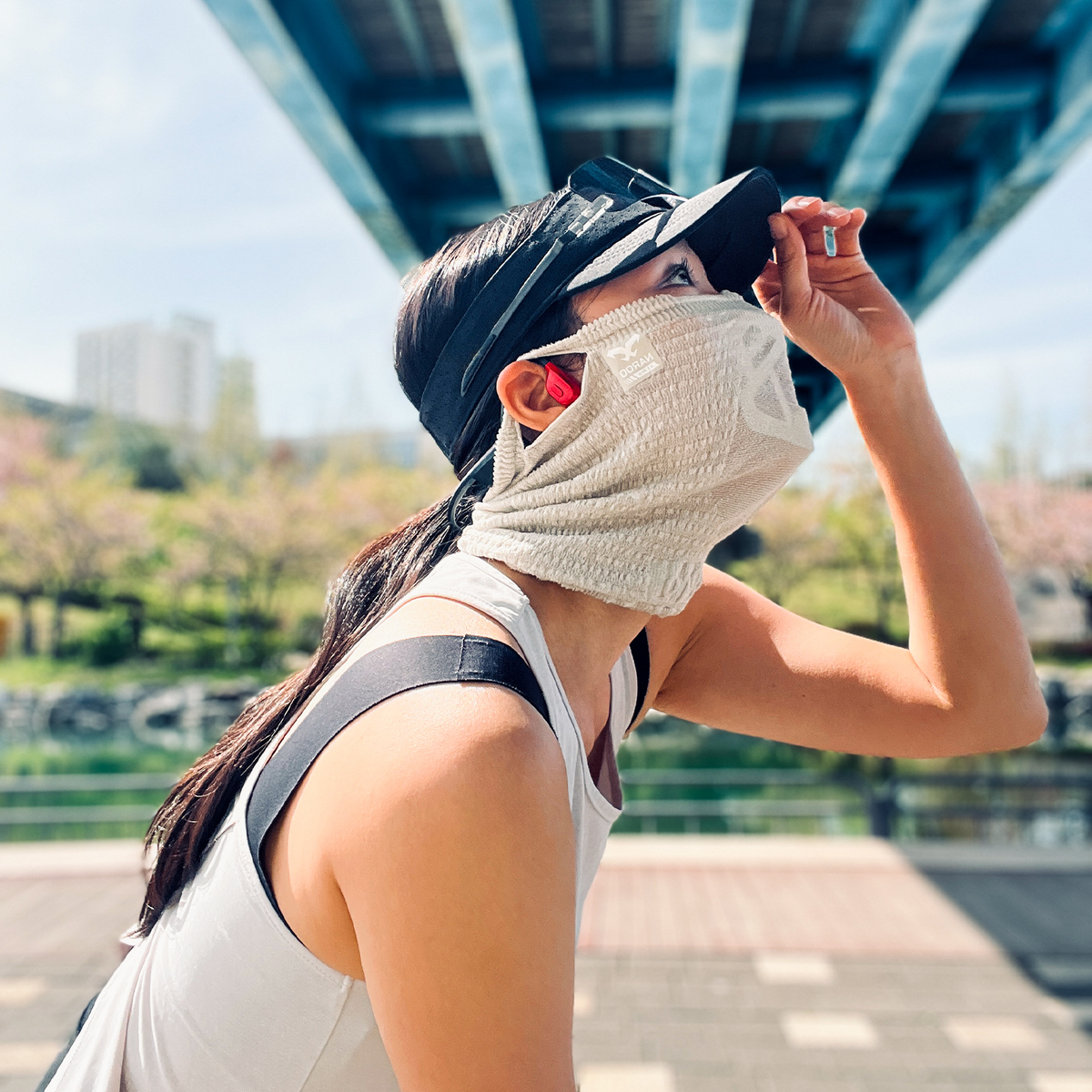 NAROO A1 Pro light-toned sports face cover worn by a cyclist outdoors