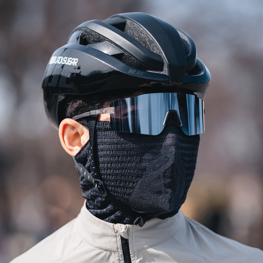 NAROO A1 Pro Smoke Black sports face cover worn by a cyclist, close-up